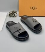 Grey UGG Slide Sandals with Gold Buckle and Stitched Sole