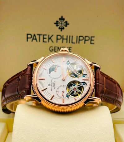 Exquisite Patek Philippe watch with white dial and brown leather strap, showcasing intricate mechanical details.