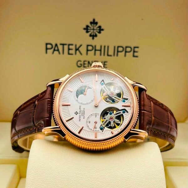 Exquisite Patek Philippe watch with white dial and brown leather strap, showcasing intricate mechanical details.