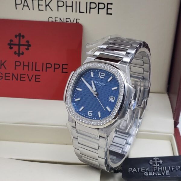 A luxurious Patek Philippe watch with a blue face and diamond-encrusted bezel, presented in an elegant box.