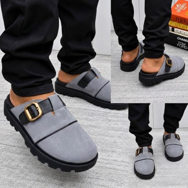 A stylish pair of grey half shoes with a gold buckle and black sole, perfect for adding a touch of luxury to any outfit.