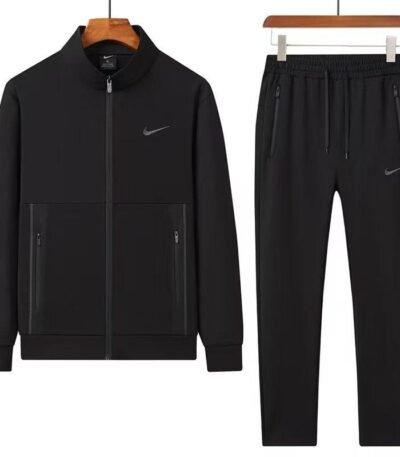 A stylish grey tracksuit consisting of a zip-up jacket and matching joggers, both featuring the Nike logo, displayed on hangers against a white background.